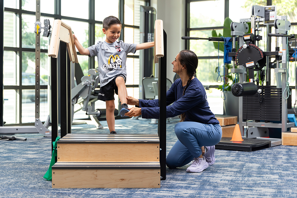 boy receiving physical therapy