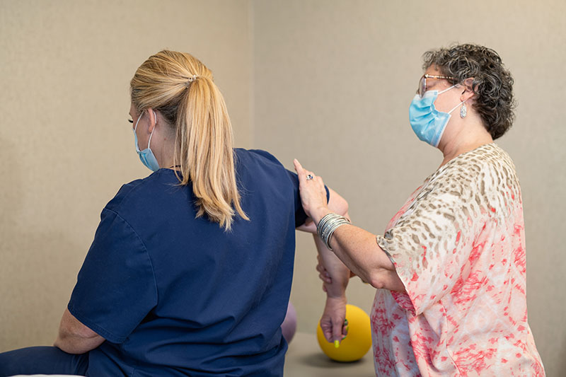 checking patient's upper arm