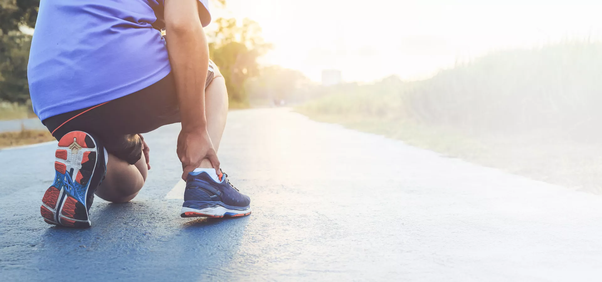 runner holding ankle